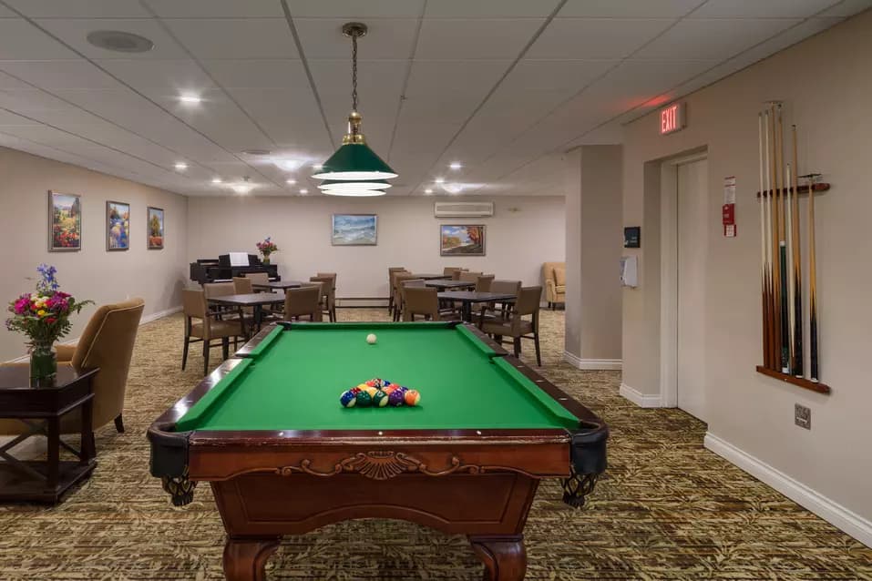 pool table lounge at chartwell willow care residence