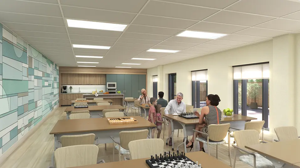 Multipurpose activity room renovation rendering with games tables and kitchenette at Chartwell Grenadier / Rendu de rénovation de la salle polyvalente avec tables de jeux et cuisinette à Chartwell