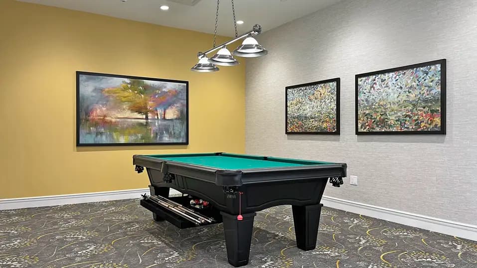 Activity room with pool table at Chartwell St. Catharines