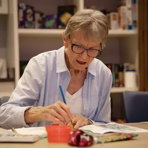 Senior lady relishing painting