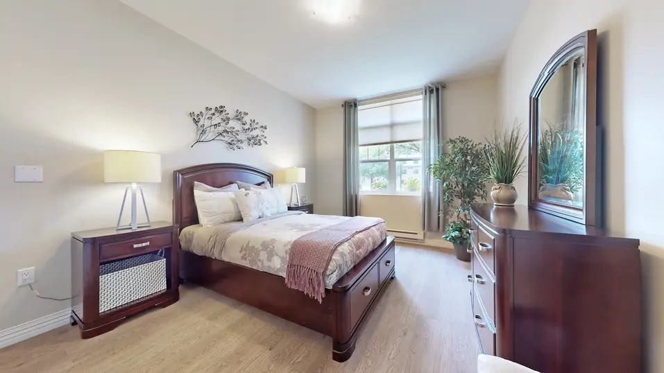 Model suite of bedroom at Chartwell Royal Oak Village