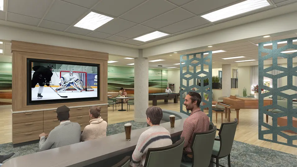Social lounge renovation rendering with TV and bar seating at Chartwell Grenadier / Rendu de rénovation du salon social avec téléviseur et sièges de bar à Chartwell Grenadier