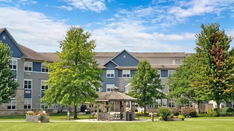 View of exterior with trees at Chartwell Royal Oak Village