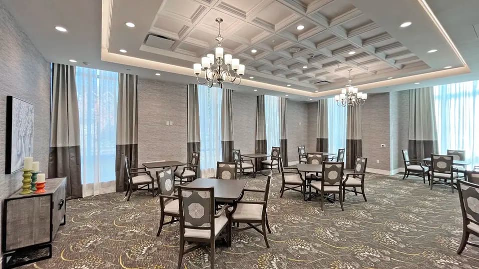 Dining room with table and chairs at Chartwell St. Catharines