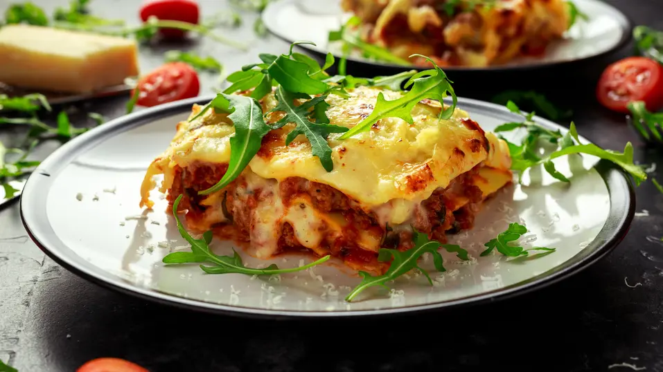 Beef lasagna with Béchamel sauce, parmesan cheese and wild arugula / Lasagnes au bœuf avec sauce béchamel, parmesan et roquette sauvage