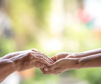 elderly-hands-holding-younger-hands-caregiving