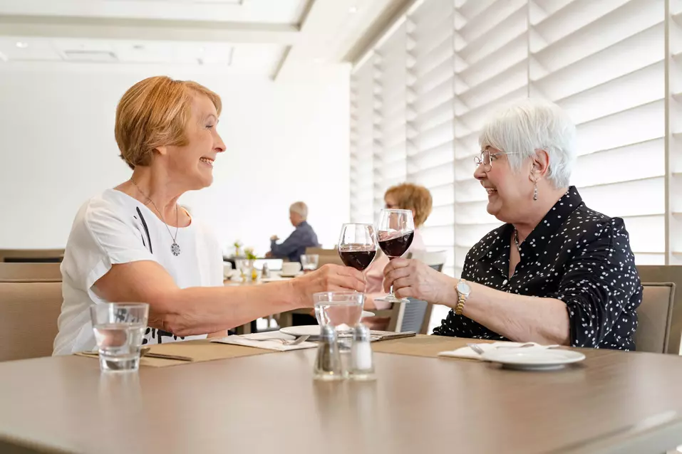 Chartwell Senior residence ladies enjoying a glass of wine on dinning table