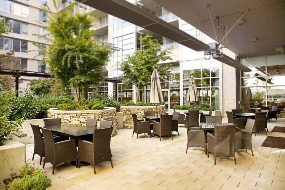 Exterior and seating area at Chartwell Wesbrook Village