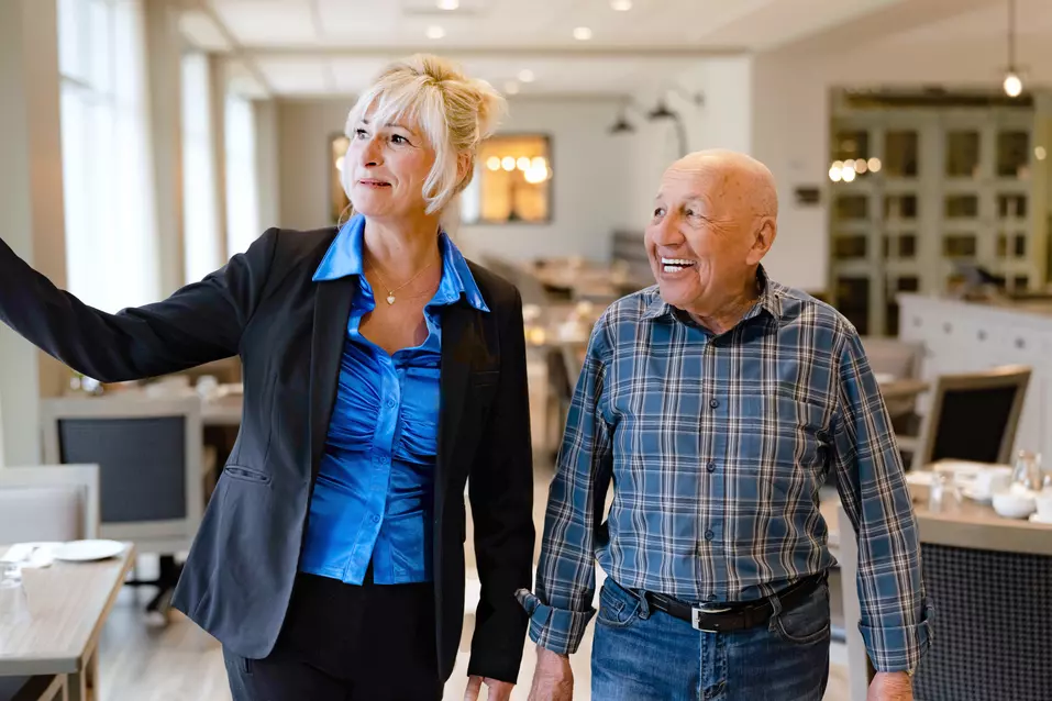 Chartwell Staff showing around the residence to a senior