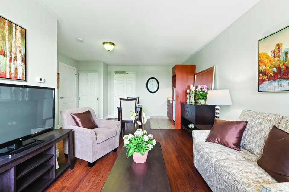 1 bedroom suite living room at chartwell collegiate heights retirement residence