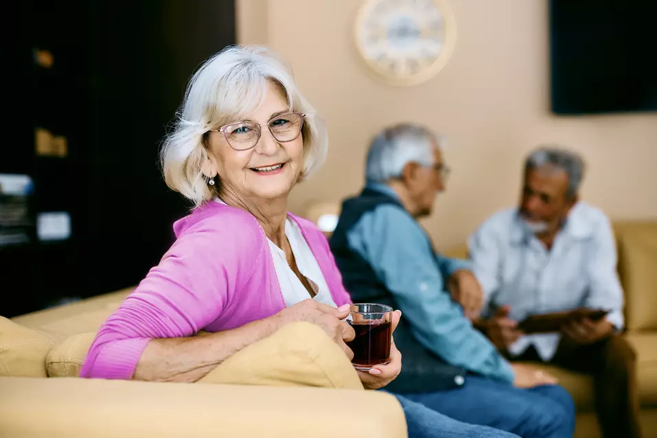 senior-woman-enjoying-cup-of-tea-in-couch