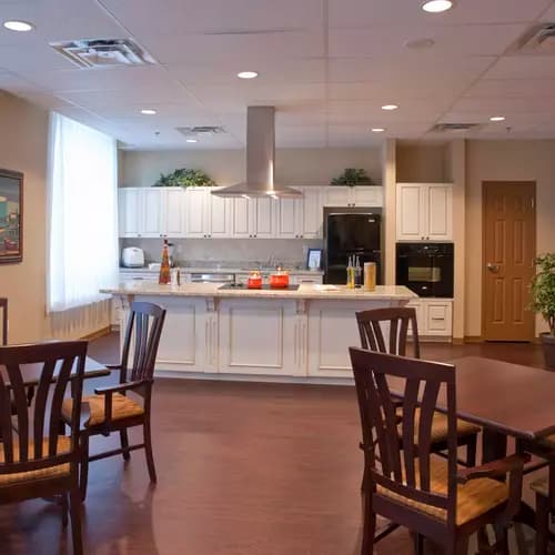 Demonstration kitchen and seating at Chartwell Valley Vista Retirement Residence