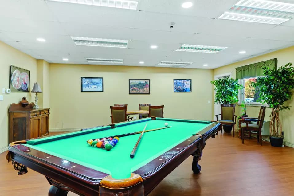 billards room at chartwell collegiate heights retirement residence