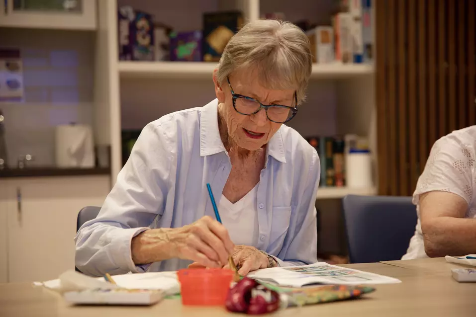 Senior lady relishing painting