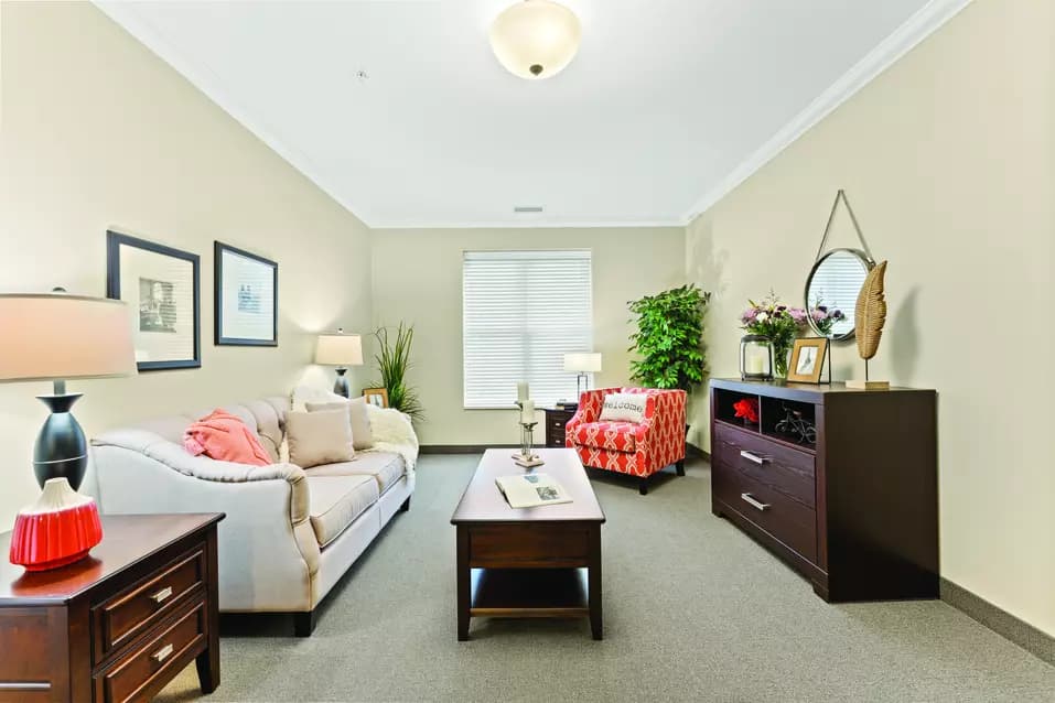 1 bedroom suite living room at chartwell bowmanville creek retirement residence