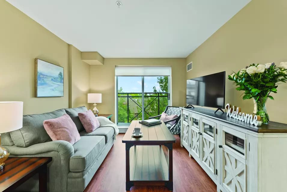 Suite living room with a view at Chartwell Hollandview Trail Retirement Residence.