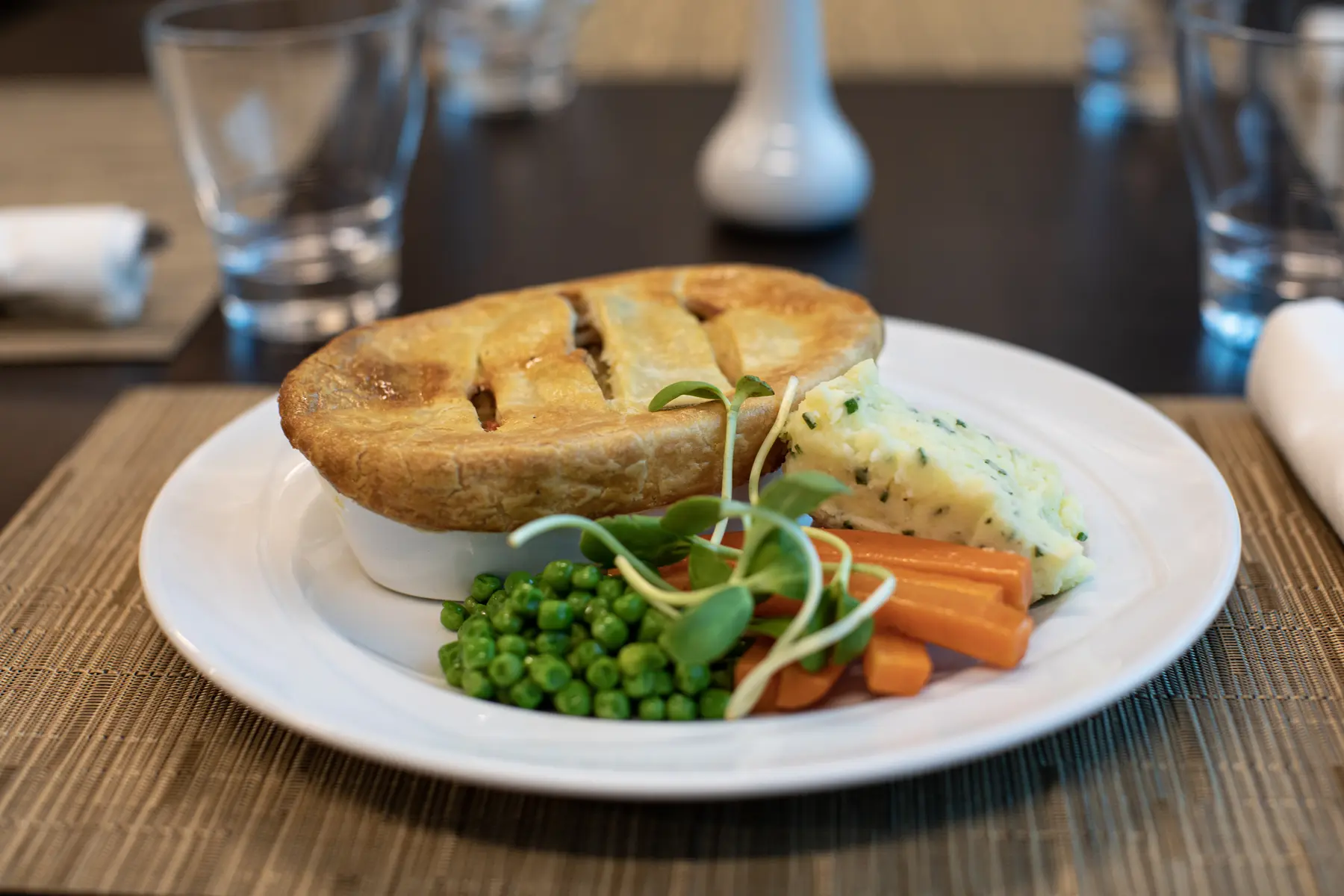 Chicken Potpie with mash potatoes, carrots and peas