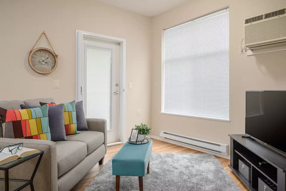 model suite living room at chartwell hampton house retirement residence