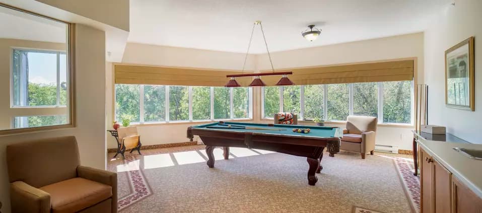 billiards room at chartwell jackson creek retirement residence