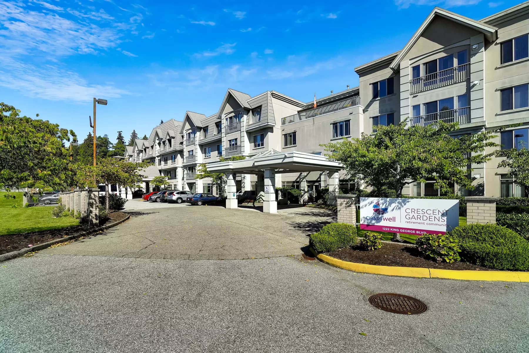 wide angle picture of front entrance at chartwell crescent gardens retirement residence