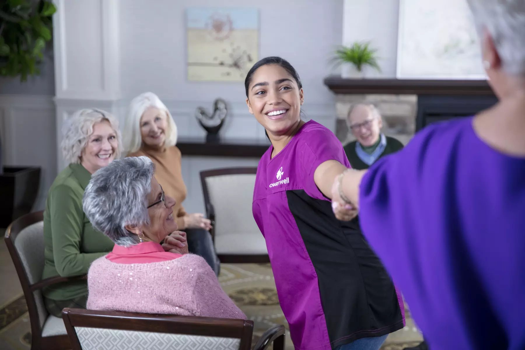 Chartwell care staff socializing with the senior residents