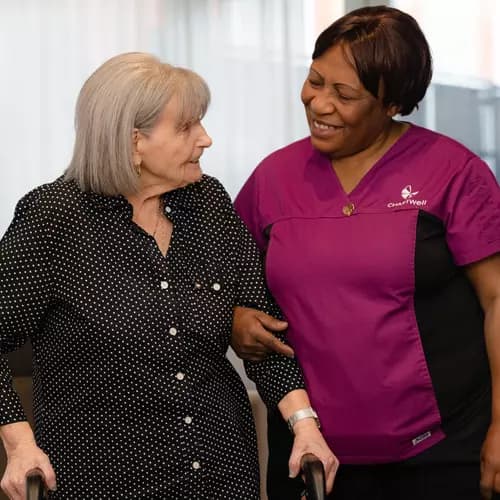 Chartwell Care staff helping senior resident walking
